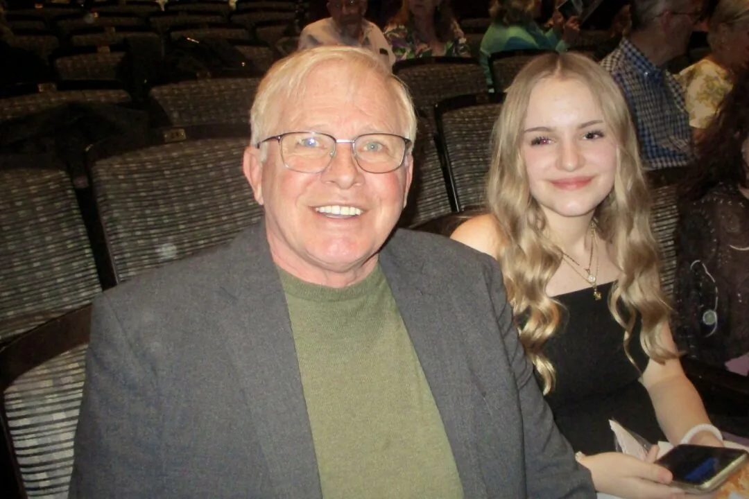 Ray Massey and his granddaughter at the Shen Yun Performing Arts performance at Southern Alberta Jubilee Auditorium on April 15, 2025. (Maple Lynn/The Epoch Times)