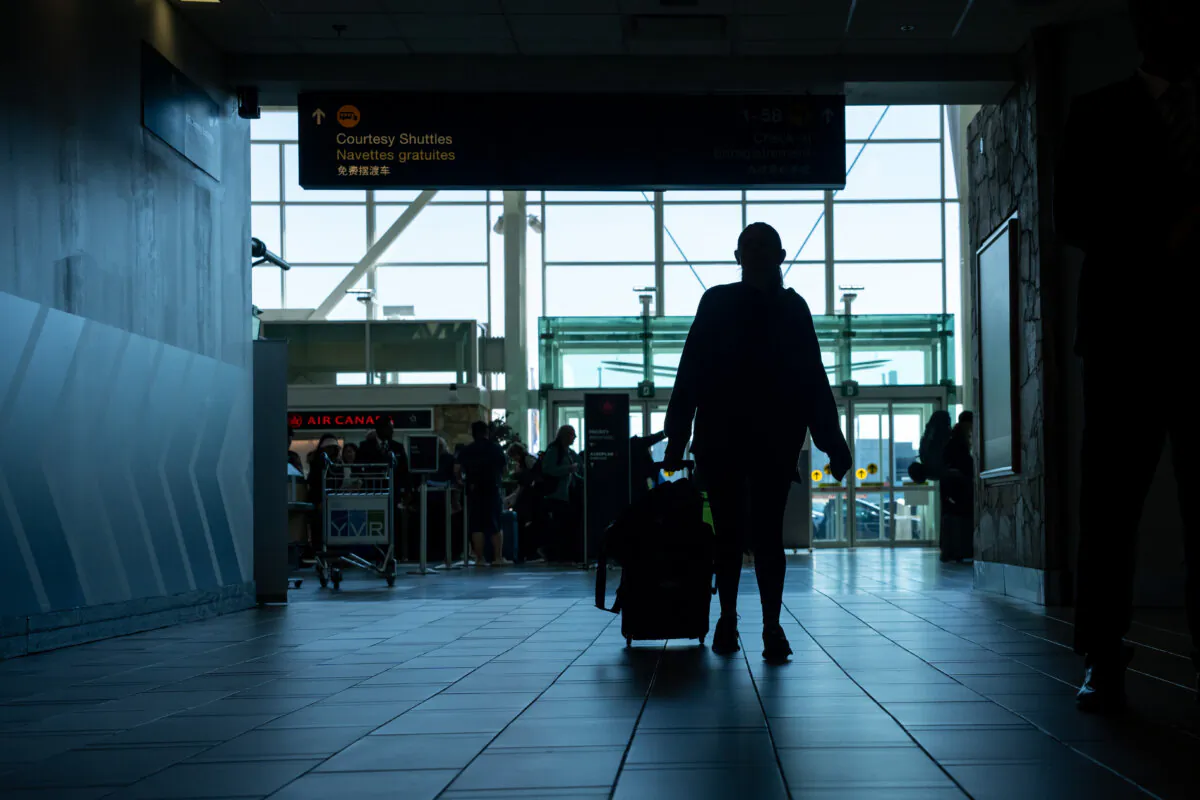 Travellers at the Vancouver International Airport in a file photo. (The Canadian Press/Ethan Cairns) 