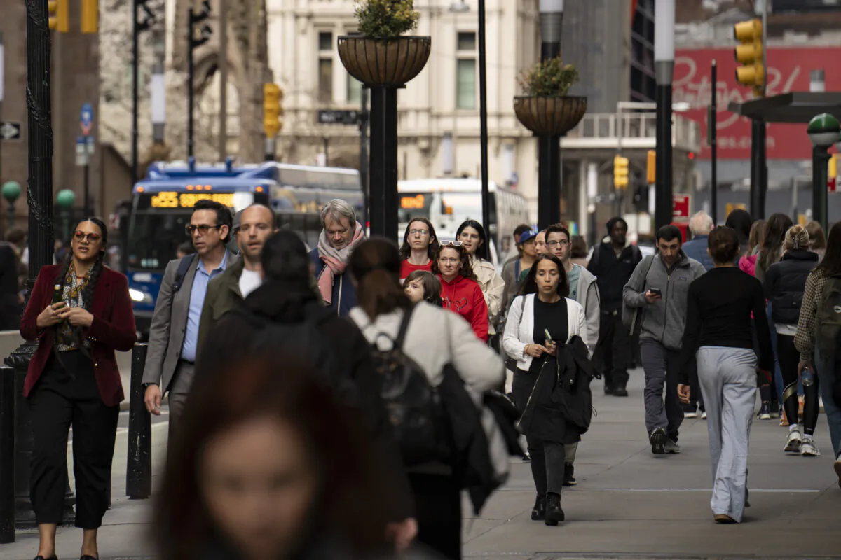 People walk on a street in New York City on April 4, 2025. (Samira Bouaou/The Epoch Times)