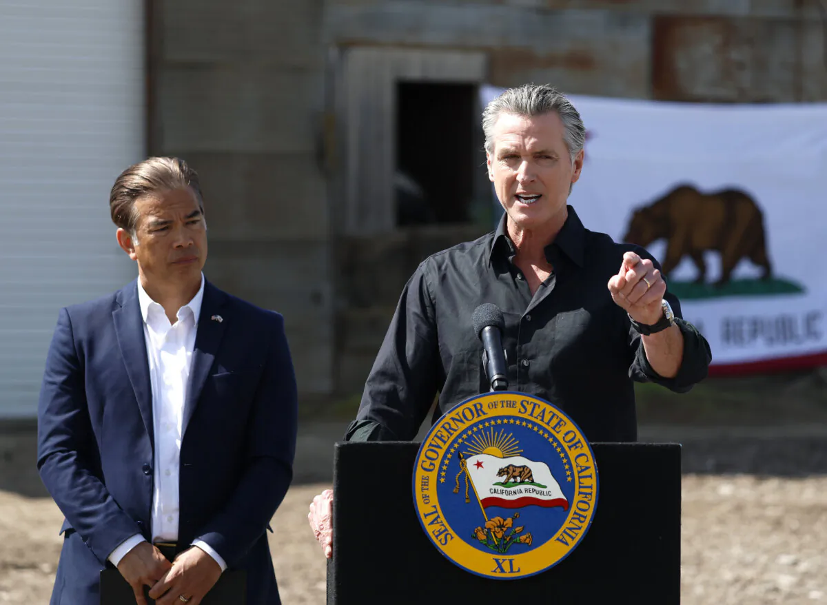 California Gov. Gavin Newsom (R) speaks as California Attorney general Rob Bonta looks on during a news conference at Gemperle Orchard in Ceres, Calif., on April 16, 2025. (Justin Sullivan/Getty Images)