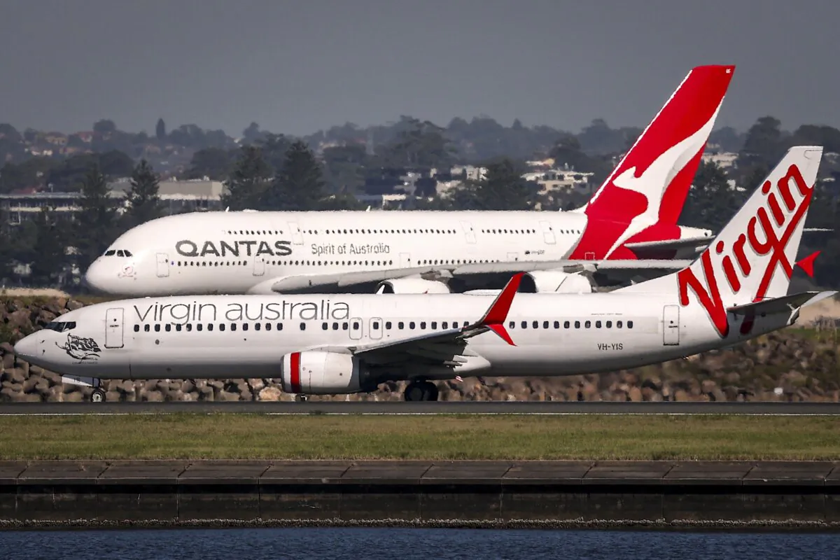 A Qantas and a Virgin aeroplane at Sydney International Airport in Sydney, Australia, on April 3, 2025. (David Gray/AFP via Getty Images)