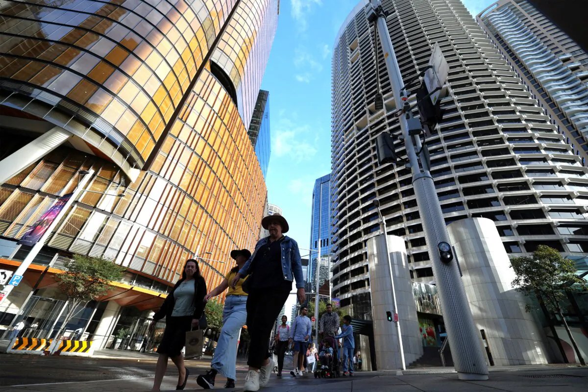 This picture taken on April 15, 2025 shows people walking among the high-rise buildings in Sydney's central business district at the end of office hours in Australia. (Saeed Khan/AFP via Getty Images)