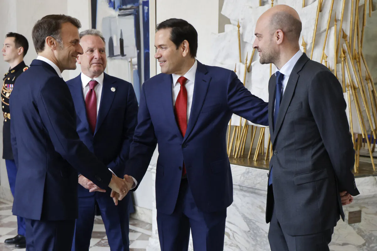 France's President Emmanuel Macron (L) shakes hands with U.S. Secretary of State Marco Rubio (2R) next to U.S. Special Envoy Steve Witkoff (C) and France's Minister for Europe and Foreign Affairs Jean-Noel Barrot before a meeting at the Elysee presidential palace in Paris on April 17, 2025. (Ludovic Marin/AFP via Getty Images)
