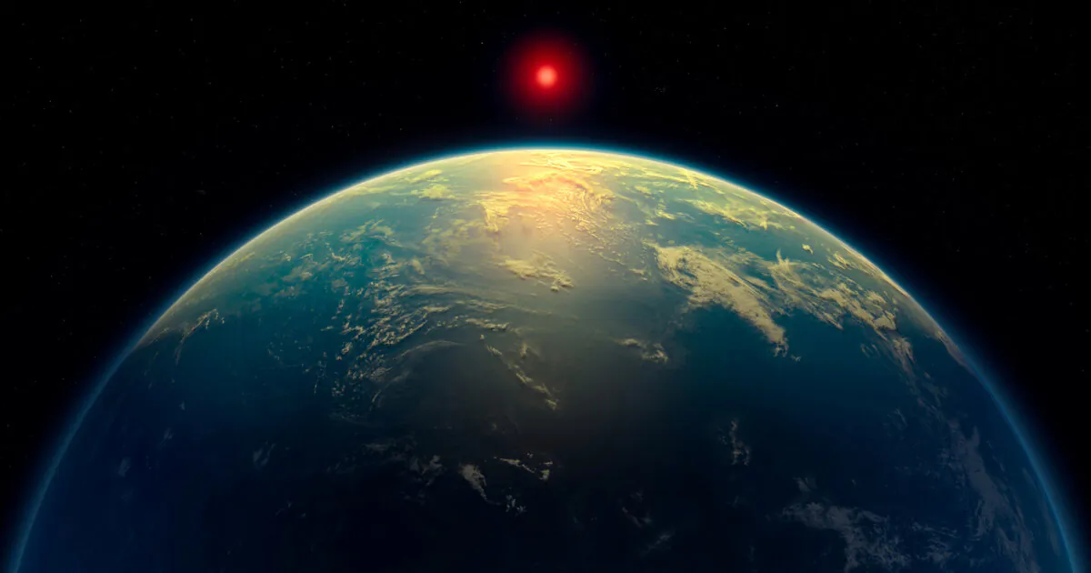 An illustration shows a hycean world—an exoplanet with a liquid water ocean beneath a hydrogen-rich atmosphere—orbiting a red dwarf star, in an illustration obtained on April 16, 2025. (A. Smith, N. Madhusudhan/University of Cambridge/Handout via Reuters)