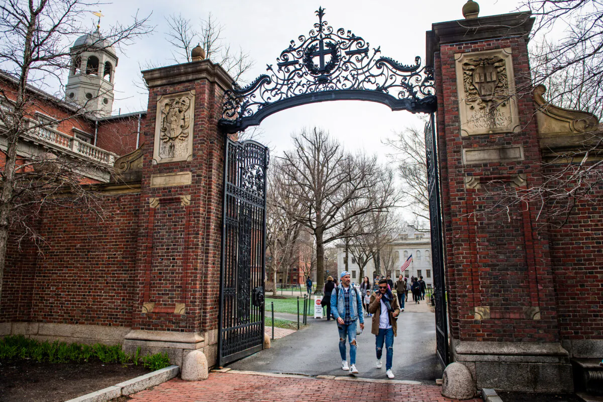 People walk through a gate as they exit Harvard Yard on the campus of Harvard University in Cambridge, Mass., on April 15, 2025. (Joseph Prezioso/AFP via Getty Images)