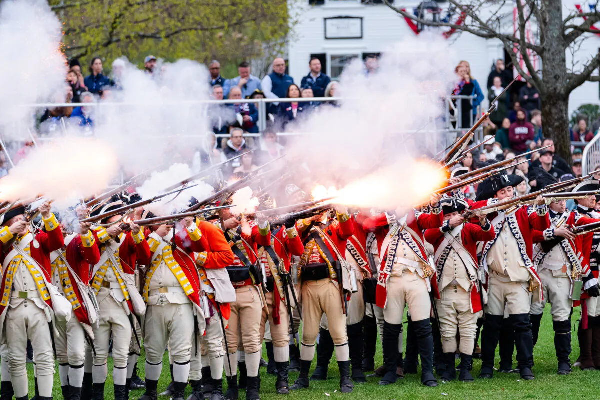 Reenactors depicting British Redcoats fire their weapons during the 250th reenactment of the Battle of Lexington and Concord in Lexington, Mass., on April 19, 2025. (Sophie Park/Getty Images)