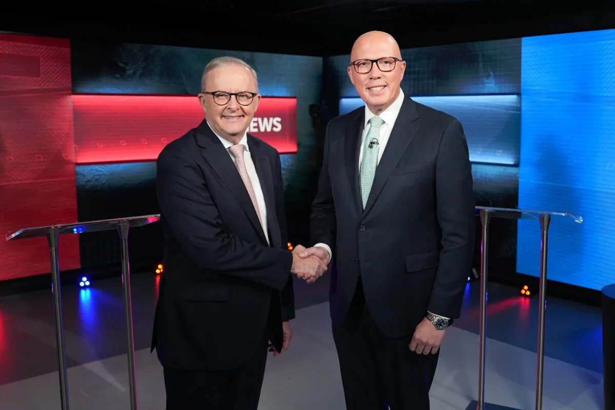 Prime Minister Anthony Albanese (L) and Opposition Leader Peter Dutton shake hands ahead of the second leaders' debate of the 2025 federal election campaign at the ABC Studios in Parramatta, Sydney, Australia, on April 16, 2025. (AAP Image/Pool)