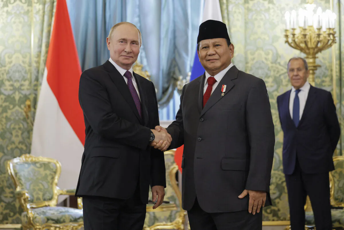 Russia's President Vladimir Putin (L) shakes hands with Indonesia's President Prabowo Subianto (R) in Moscow, Russia, on July 31, 2024. (Maxim Shemetov/POOL/AFP via Getty Images)