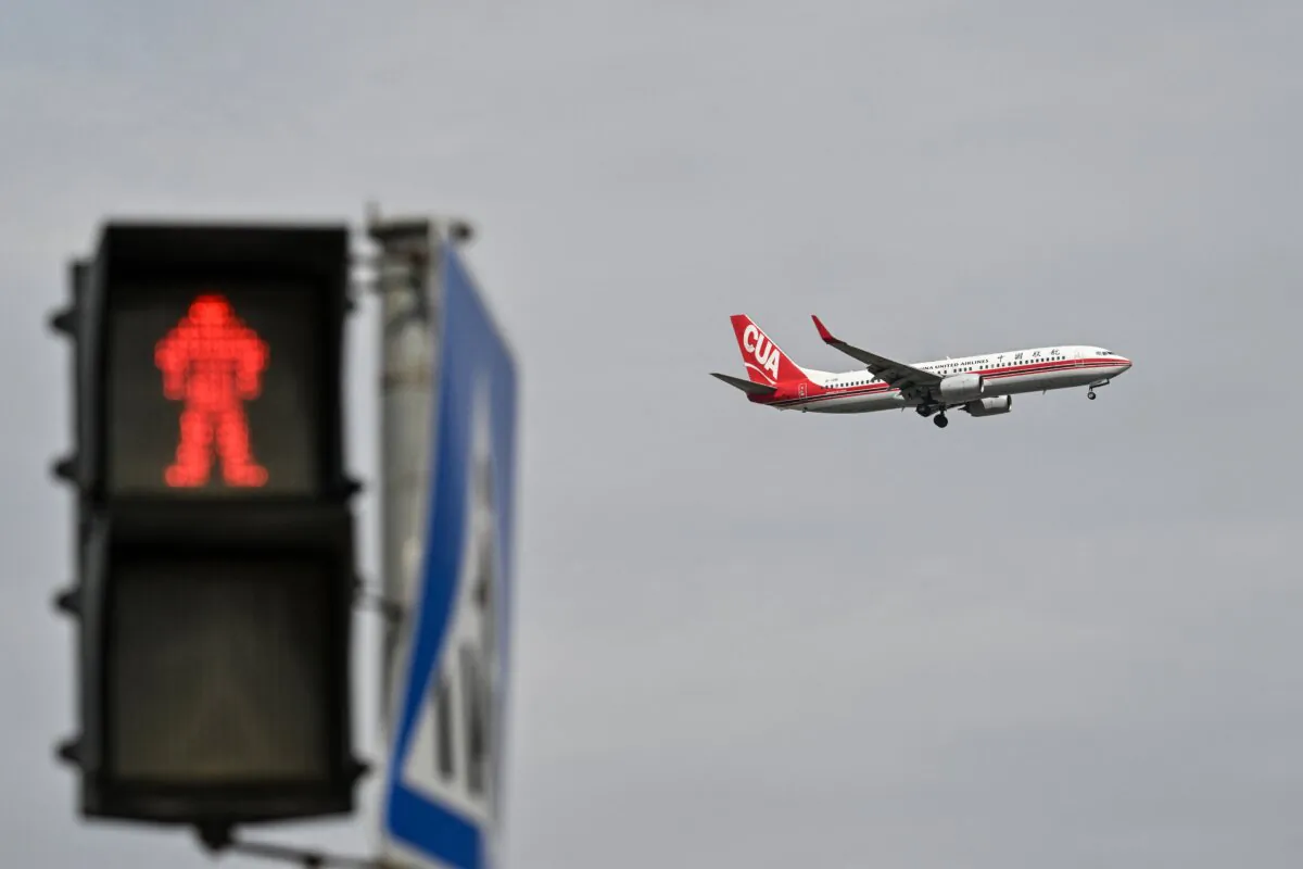 A Boeing 737-800 of China United Airlines prepares to land at Shanghai Pudong International Airport in Shanghai on April 16, 2025. (Hector Retamal/AFP via Getty Images)