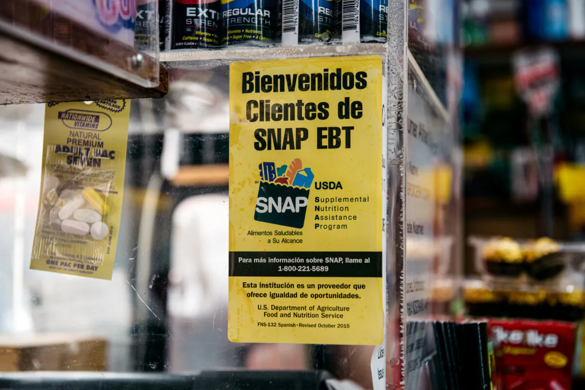 A sign alerting customers about SNAP food stamps benefits is displayed in a grocery store in Brooklyn, New York, on Dec. 5, 2019. (Scott Heins/Getty Images)