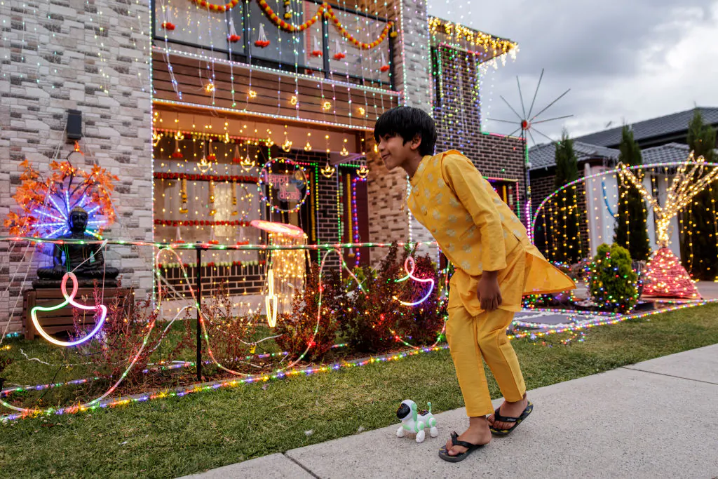 A young boy enjoys the Diwali light show put on by residents of Phantom Street, Nirimba Fields in western Sydney on Nov. 1, 2024. The Diwali festival, one of Hinduism's biggest, is celebrated by Indian-origin people across the world. (Brook Mitchell/Getty Images)