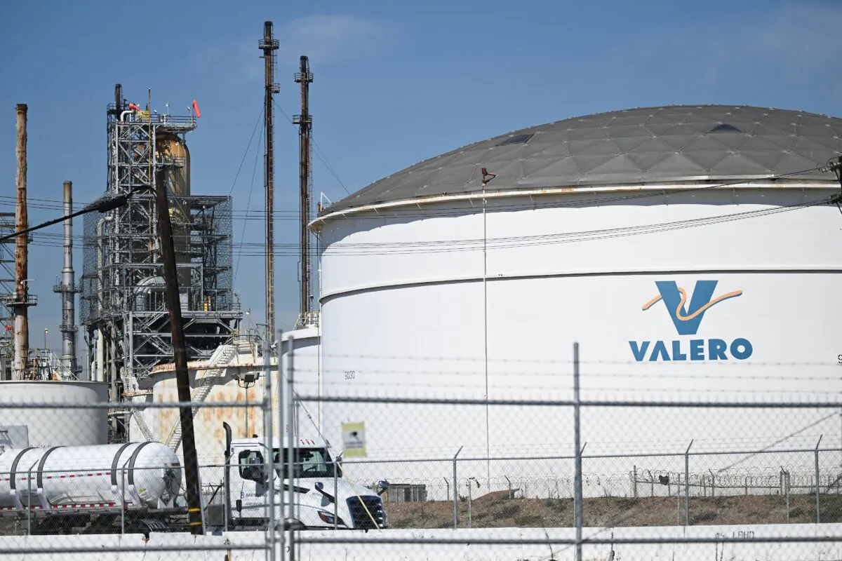The Valero logo is displayed on a tank at the Valero Wilmington Oil Refinery adjacent to the ports of Long Beach and Los Angeles in the Wilmington neighborhood of Los Angeles, Calif. (Patrick T. Fallon/AFP via Getty Images)