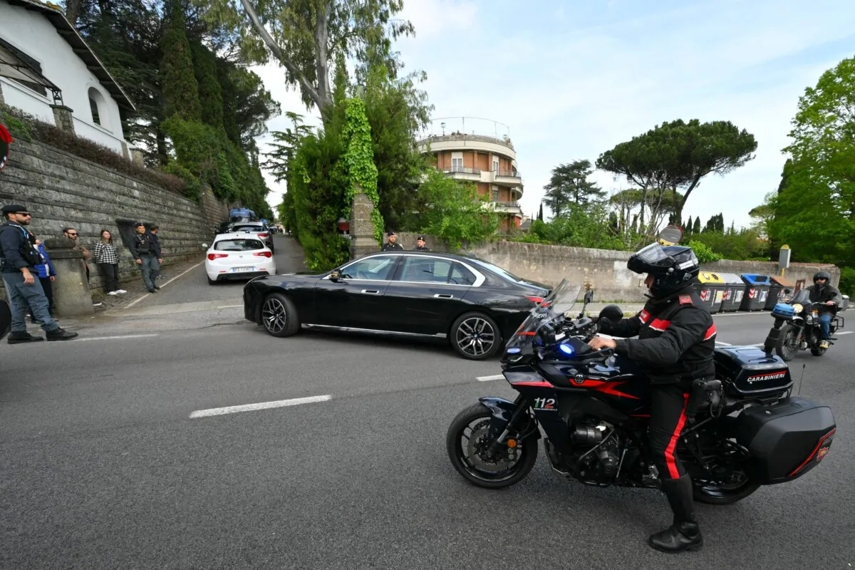 Vehicles are escorted by Italian police at the entrance to the Omani Embassy in Rome where a second round of nuclear talks between Iran and the United States were held on April 19, 2025. (Andreas Solaro/AFP via Getty Images)