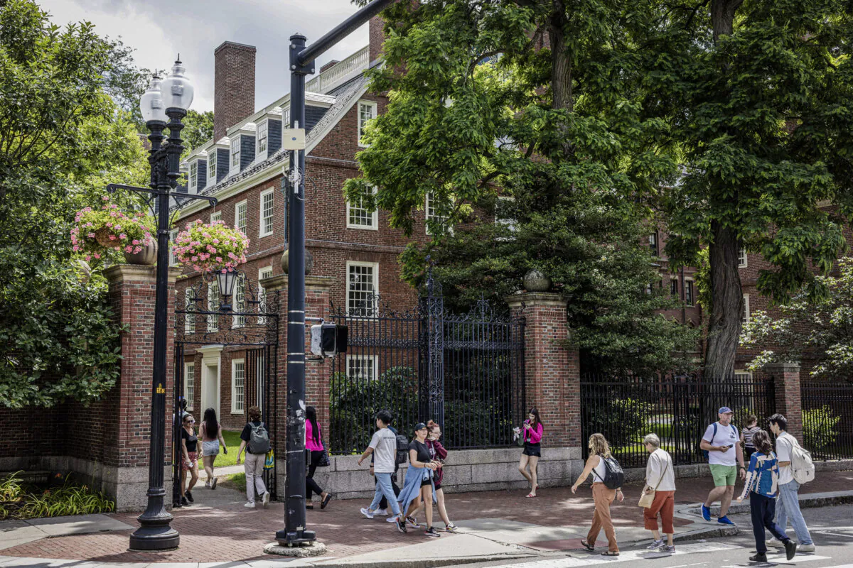 People walk through the gate on Harvard Yard at the Harvard University campus in Cambridge, Mass., on June 29, 2023. (Scott Eisen/Getty Images)