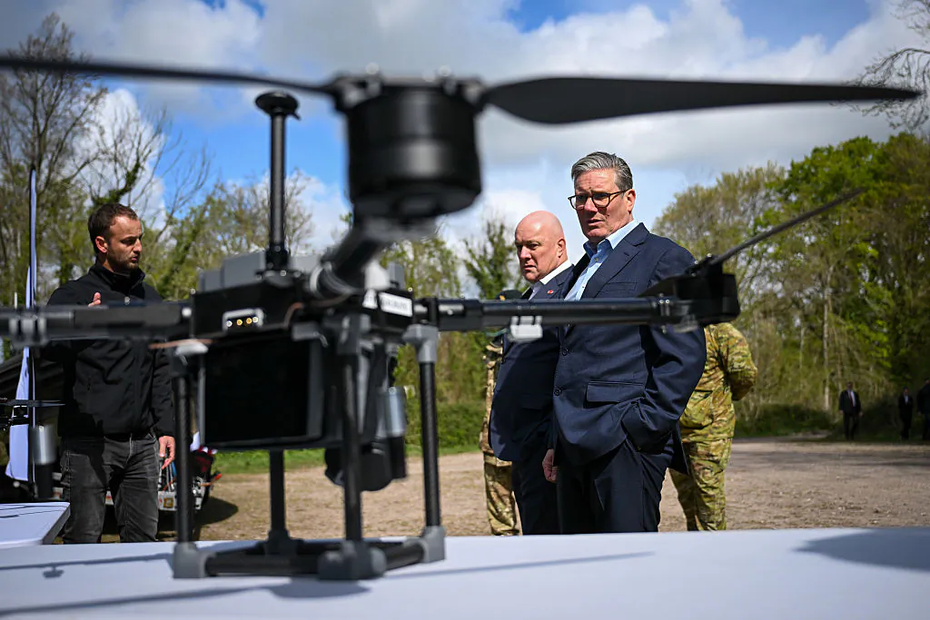 UK Prime Minister, Sir Keir Starmer, and Prime Minister of New Zealand, Christopher Luxon, look at drones on a display by SYOS, during a visit to a military base training Ukrainian troops in West of England, on April 22, 2025. (Finnbarr Webster/Getty Images)