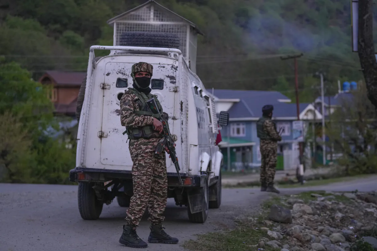 Indian security officers stand guard on a highway in south Kashmir, India, on April 22, 2025. (Dar Yasin/AP)