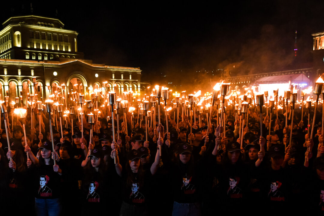 NextImg:Day in Photos: Torch March in Yerevan, Wildfire in New Jersey, and Largest Strawberry Cake