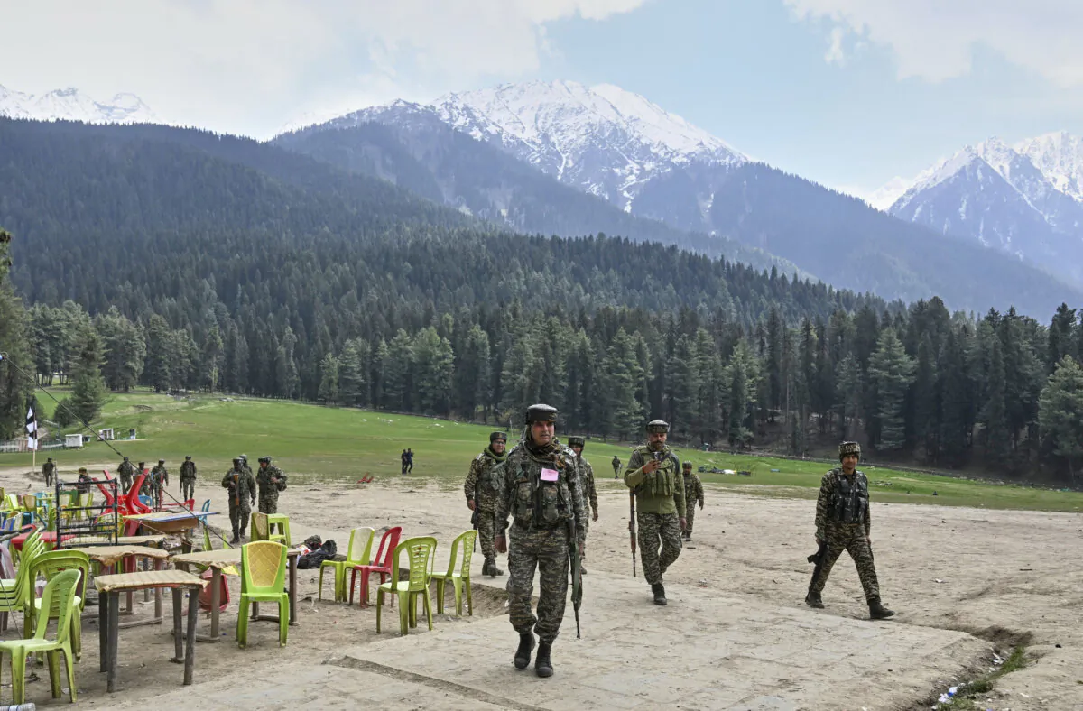 Indian security officers inspect the site where terrorists opened fire on tourists in Pahalgam, in Indian-controlled Kashmir, on April 23, 2025. (AP Photo)