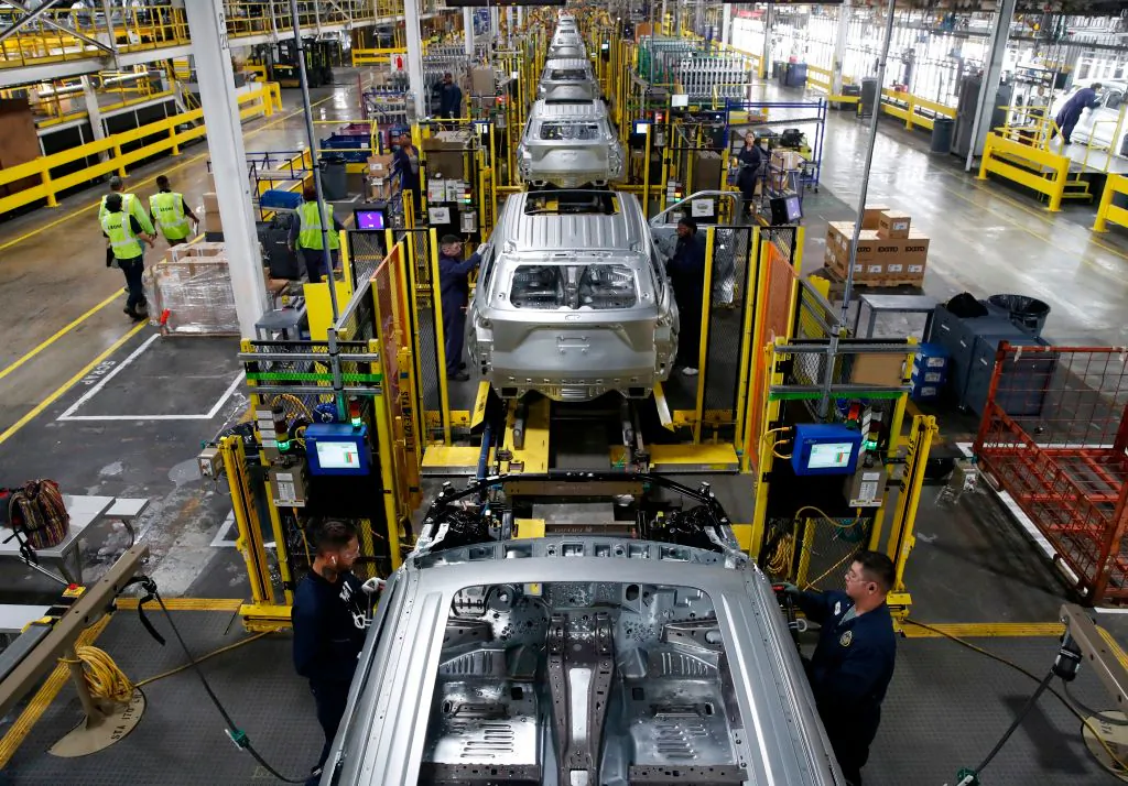Workers assemble cars at Ford's Chicago Assembly Plant. (Jim Young / AFP via Getty Images)