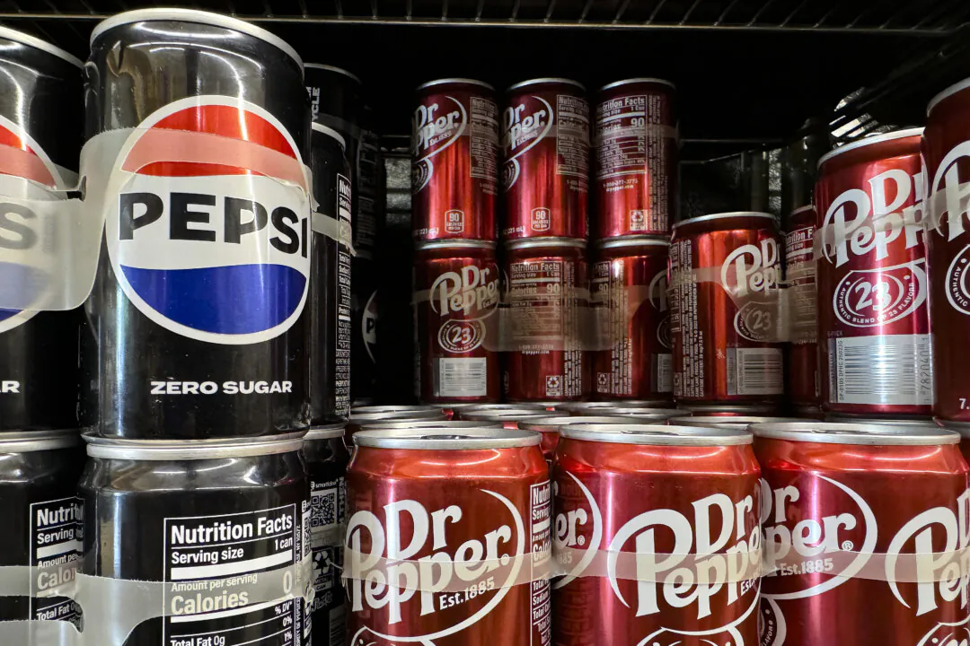 Cans of Dr. Pepper and Pepsi are displayed on a shelf at a grocery store in San Anselmo, Calif., in a file photo. (Justin Sullivan/Getty Images)