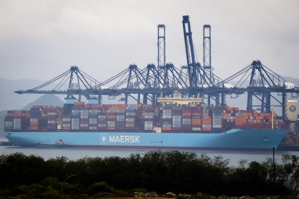 A Maersk container ship is docked at the Yantian International Container Terminal, with multiple gantry cranes positioned for cargo handling, in Shenzhen, China, on April 12, 2025. (Cheng Xin/Getty Images)