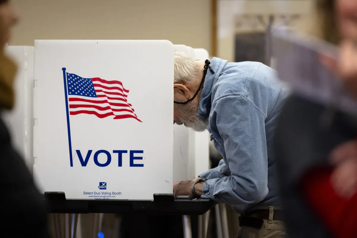 Residents vote at a polling place inside the Heritage Oaks apartment homes in Madison, Wis., on April 1, 2025. (Scott Olson/Getty Images)