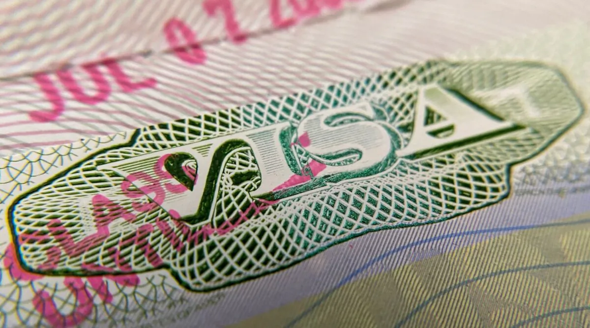 A visa stamp on a foreign passport in Los Angeles on June 6, 2020. (Chris Delmas/AFP via Getty Images)
