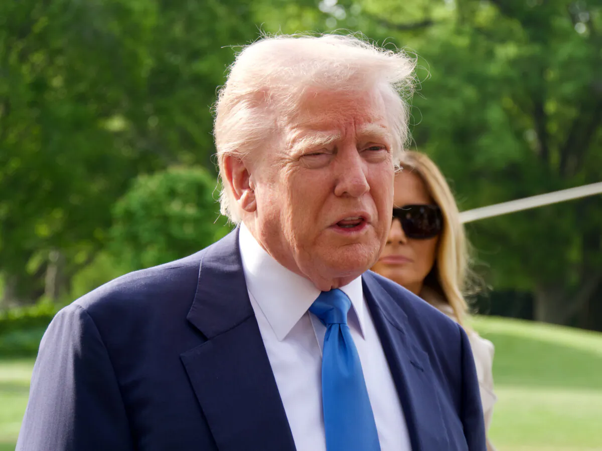 President Donald Trump speaks to reporters at the White House before departing on Marine One on April 25, 2025. (Travis Gillmore/The Epoch Times)