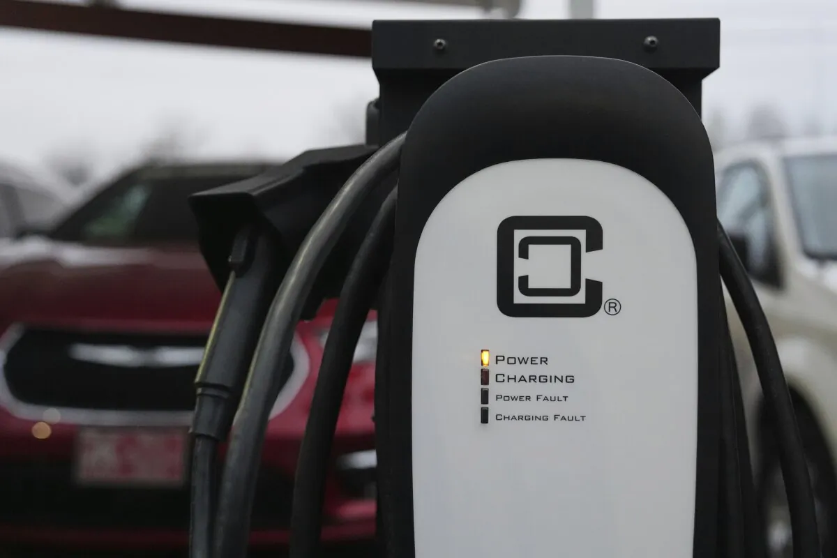 An electric vehicle charging station operates in a parking lot in Evansville, Indiana, on April 11, 2025. (Joshua A. Bickel/AP Photo)