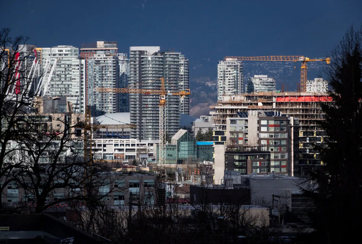 Construction cranes tower above condos under construction near southeast False Creek in Vancouver in a file photo. (The Canadian Press/Darryl Dyck) 