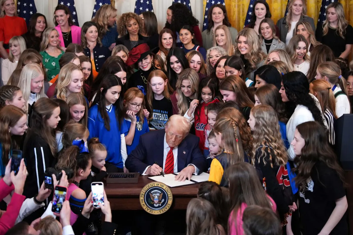 President Donald Trump joined by female athletes signs the "No Men in Women’s Sports" executive order in the East Room of the White House in Washington on Feb. 5, 2025. (Andrew Harnik/Getty Images)