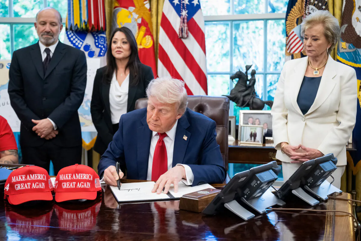 US President Donald Trump speaks to the media after signing executive orders relating to higher education institutions, alongside US Secretary of Commerce Howard Lutnick (L) and US Secretary of Education Linda McMahon (R), in the Oval Office of the White House in Washington, D.C., on April 23, 2025. (Photo by SAUL LOEB / AFP) (Photo by SAUL LOEB/AFP via Getty Images)