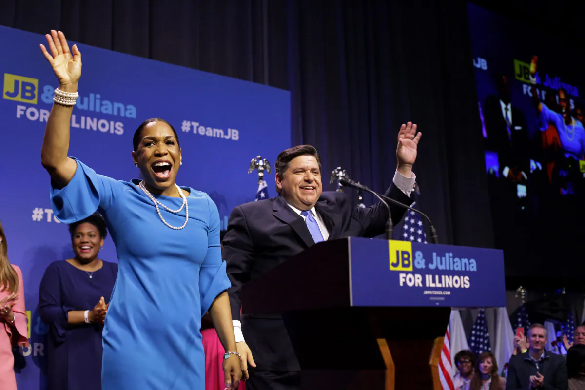Illinois Democratic candidate for governor J.B. Pritzker and his lieutenant governor pick, Juliana Stratton, arrive during his primary election night victory event in Chicago on March 20, 2018. Pritzker beat won the democratic primary against challengers Chris Kennedy and Daniel Bliss in the governor's race. (Joshua Lott/Getty Images)