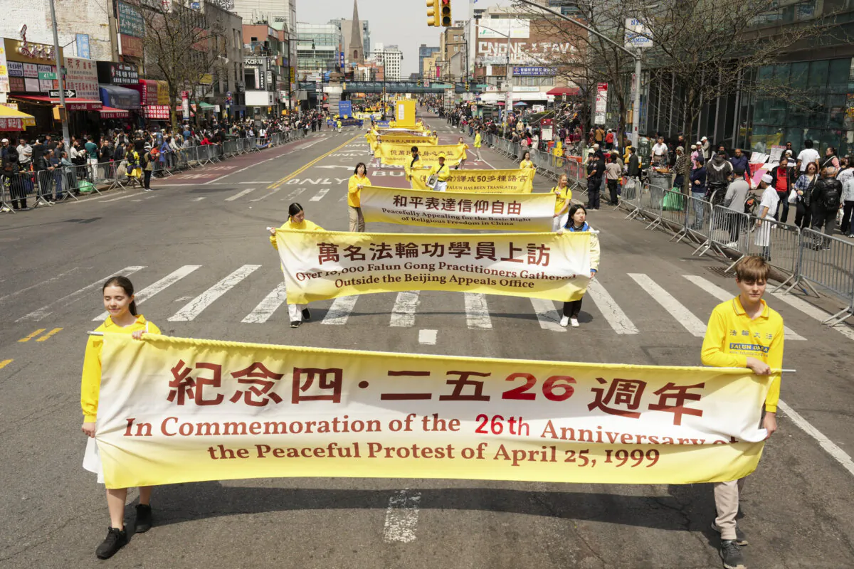 Falun Gong practitioners take part in a parade to call for the end to the persecution in China and commemorate the 26th anniversary of the April 25 appeal, in Flushing, New York, on April 19, 2025. (Larry Dye/The Epoch Times)