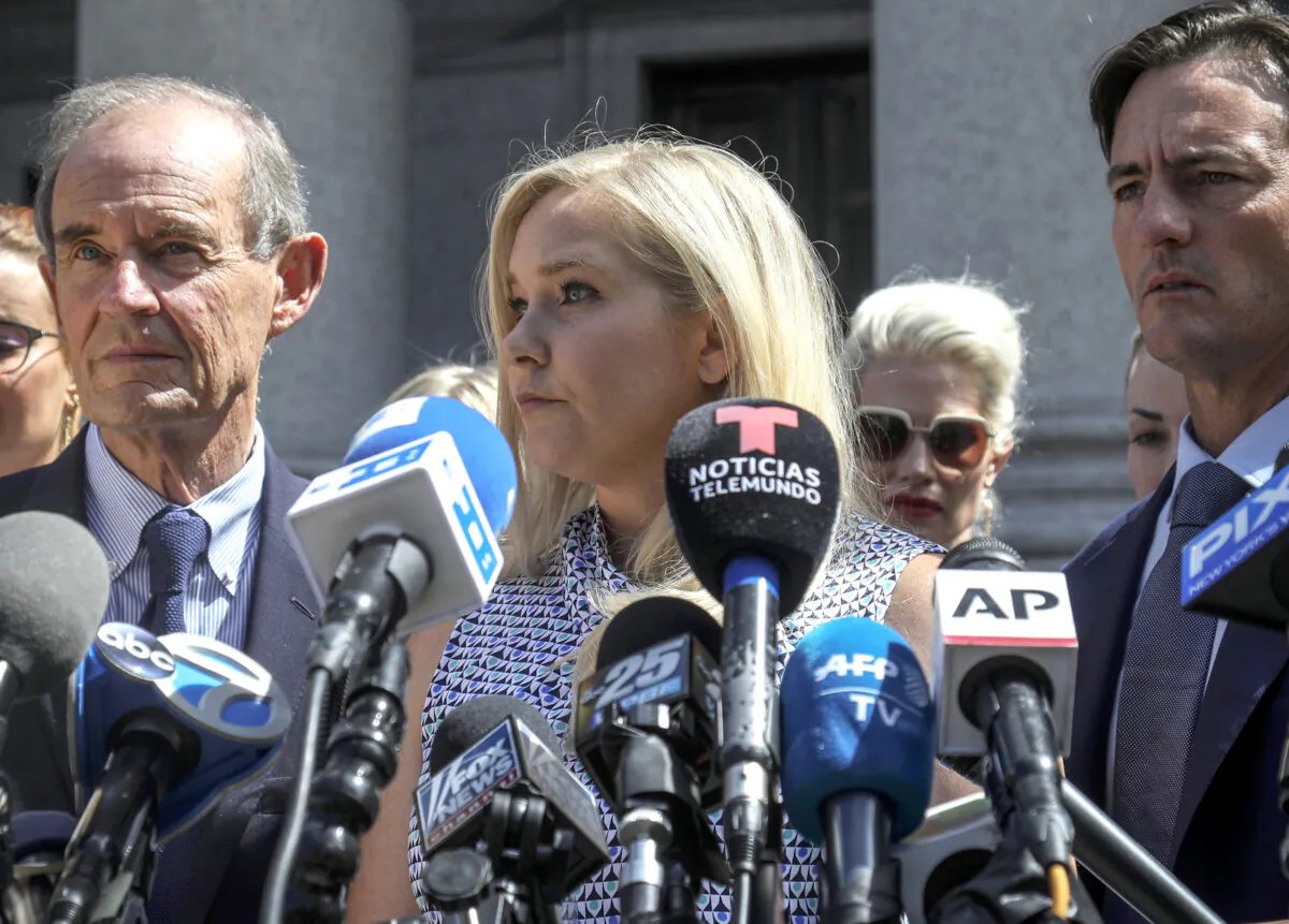 Virginia Giuffre (C) holds a news conference outside a Manhattan court in New York on Aug. 27, 2019. (Bebeto Matthews/AP Photo)