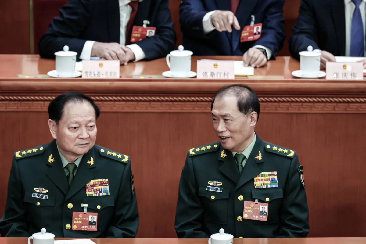 (L-R) Vice Chairman of the Central Military Commission Zhang Youxia and He Weidong attend a plenary meeting of the National People’s Congress in Beijing on March 12, 2023. (Lintao Zhang/Getty Images)