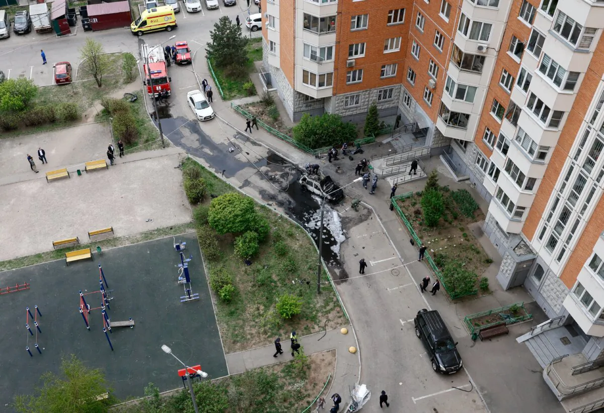 Law enforcement officers work at the site of a car bomb, which killed senior Russian military officer, in Balashikha, outside Moscow, Russia, on April 25, 2025. (Yulia Morozova/Reuters)
