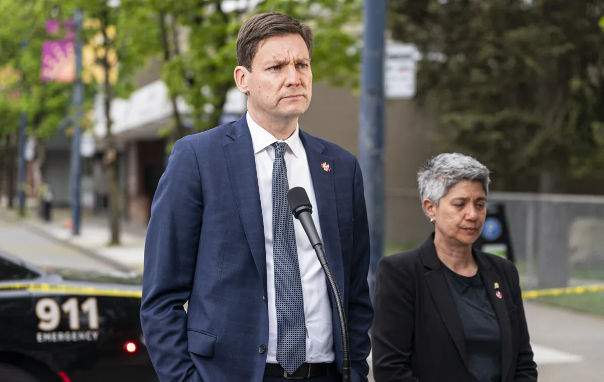 B.C. Premier David Eby and MLA Mable Elmore deliver remarks regarding a vehicle ramming into the crowd at a street festival in Vancouver on April 27, 2025. (The Canadian Press/Rich Lam)
