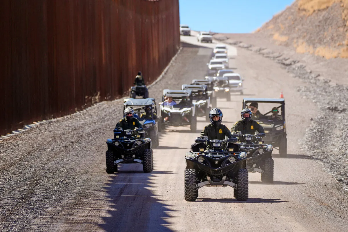 Secretary of Homeland Security Kristi Noem (C) rides a four-wheeler during a tour along the Nogales border wall at the Mariposa Port of Entry in Nogales, Ariz., on March 15, 2025. (Alex Brandon/Pool/AFP via Getty Images)