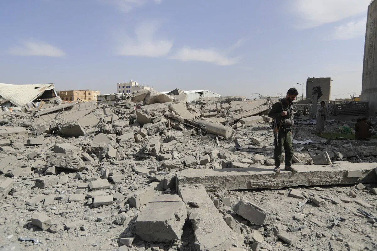 A Houthi terrorist checks damage from strikes attributed by Yemeni media to the United States, in the Houthi-controlled capital of Sanaa, Yemen, on April 27, 2025. (Mohammed Huwais/AFP via Getty Images)
