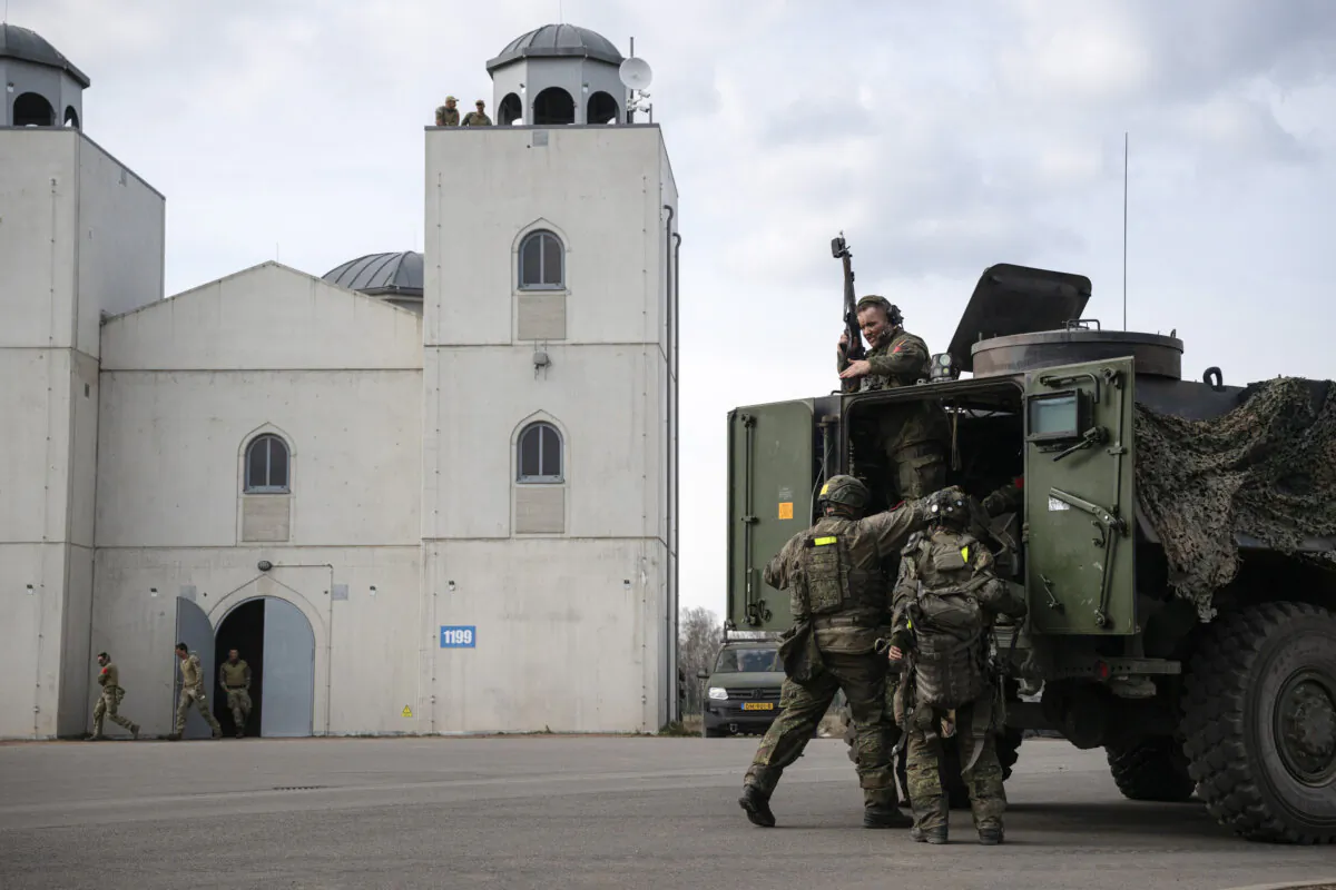 German soldiers simulate urban combat together with members of the Dutch military during the ongoing Bastion Lion military exercise near Gardelegen, Germany, on April 9, 2025. (Tamir Kalifa/Getty Images)