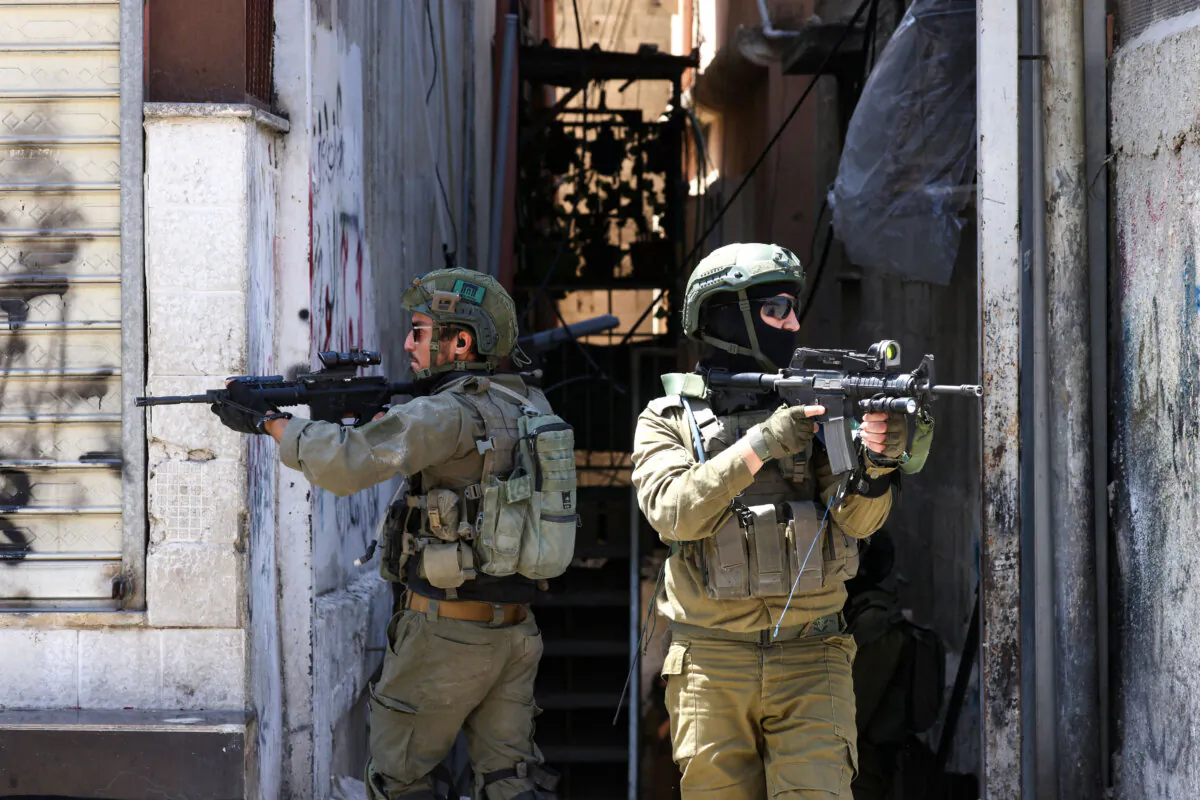 Israeli soldiers conduct a raid in the Al-Ain camp for Palestinian refugees west of Nablus in the occupied West Bank, on April 28, 2025. (Jaafar Ashtiyeh/AFP via Getty Images)