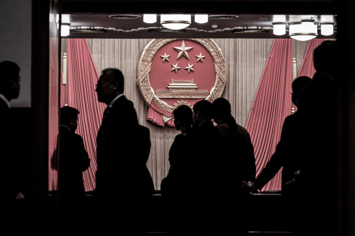 Delegates and security gather at the entrance to the auditorium before the closing session of the National People’s Congress at the Great Hall of the People in Beijing on March 11, 2024. (Kevin Frayer/Getty Images)