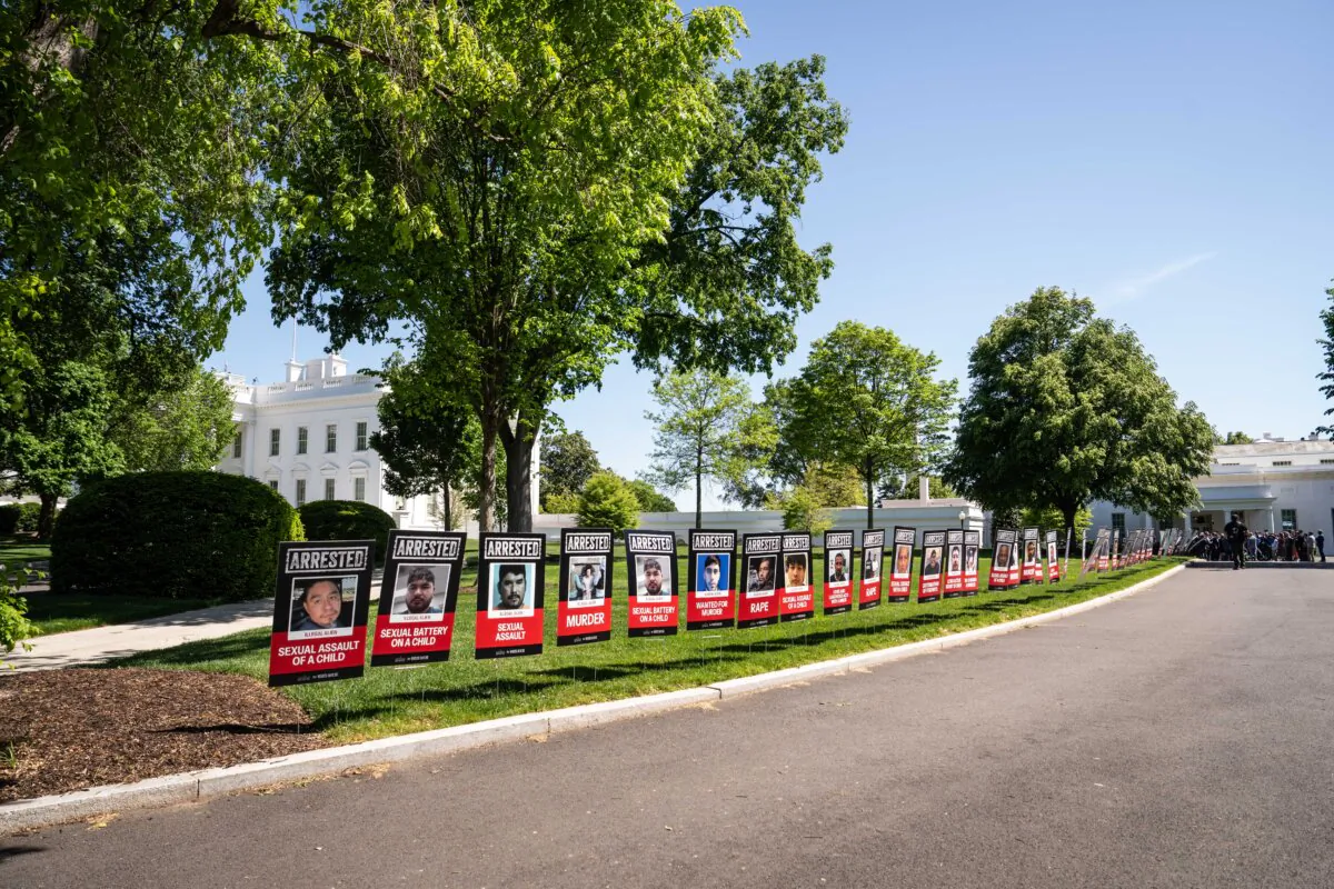 Signs depicting mugshots of illegal immigrants arrested over the past three months and their alleged violent crimes are displayed at the White House on April 28, 2025. (Madalina Vasiliu/The Epoch Times)