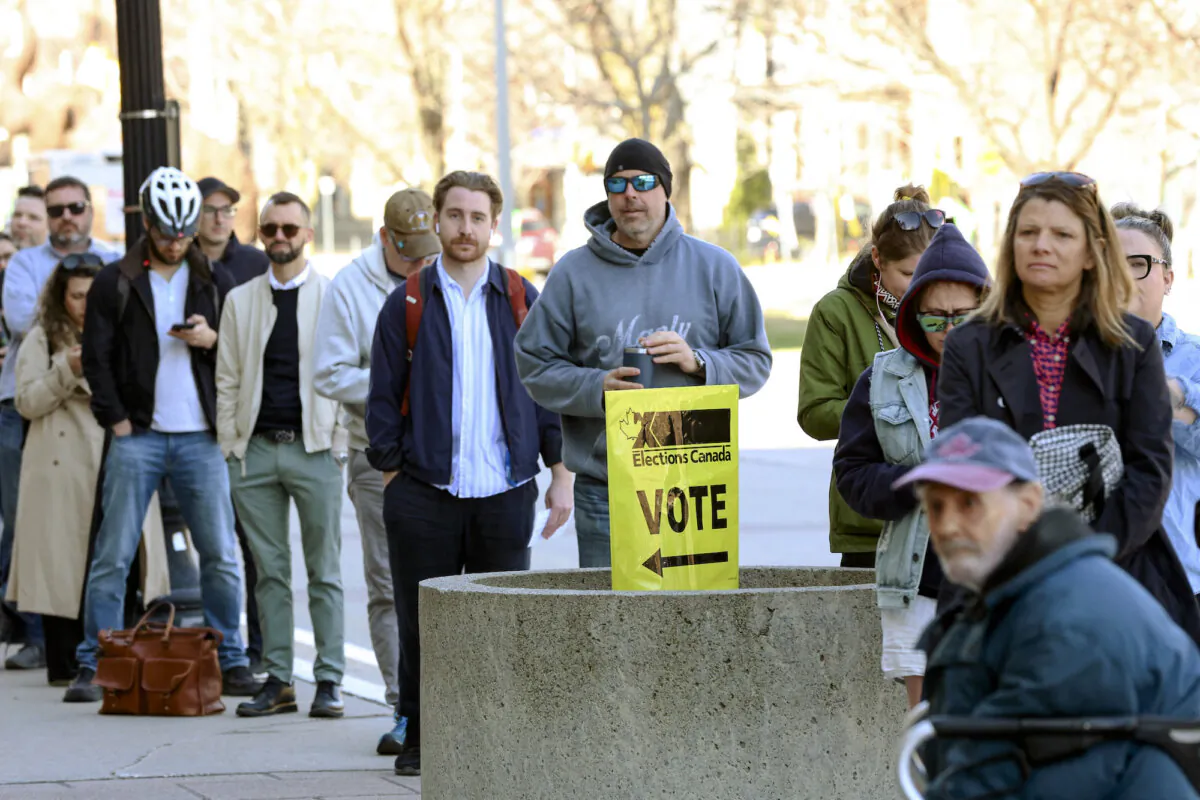Voters lining up outside a polling station prior to opening to cast their ballots on election day, in Ottawa, Canada, on April 28, 2025. (Dave Chan/AFP/Getty Images)