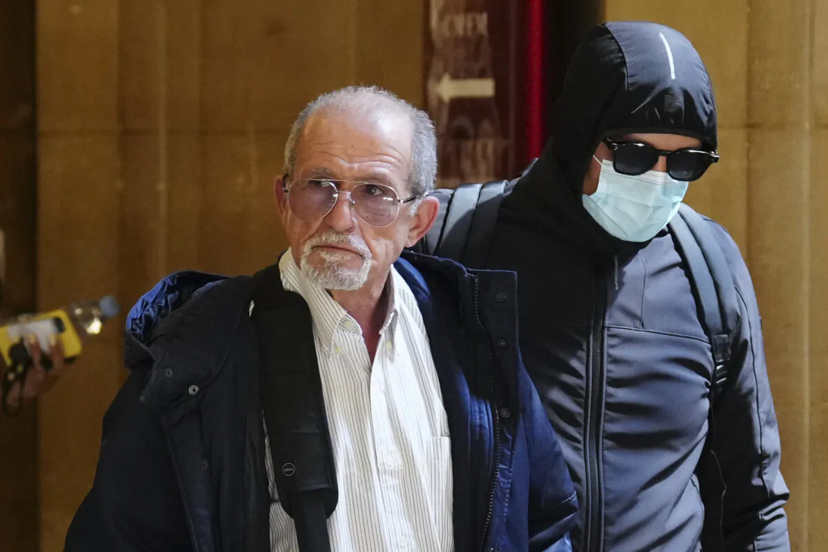 Defendant Aomar Aït Khedache (L), one of the men accused in the 2016 armed robbery of Kim Kardashian, arrives at the palace of justice in Paris on April 28, 2025. (Aurelien Morissard/AP Photo)