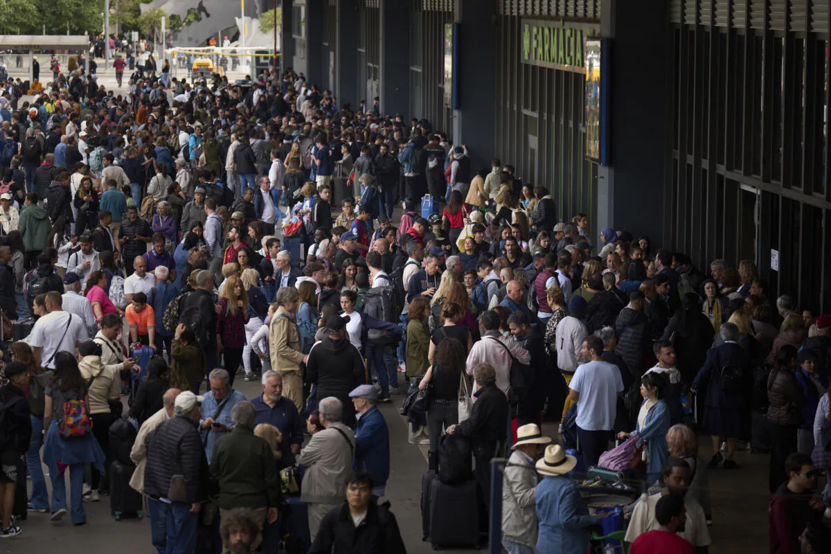 People wait outside a closed train station, during a major power outage in Barcelona, Spain, on April 28, 2025. (Emilio Morenatti/AP Photo)