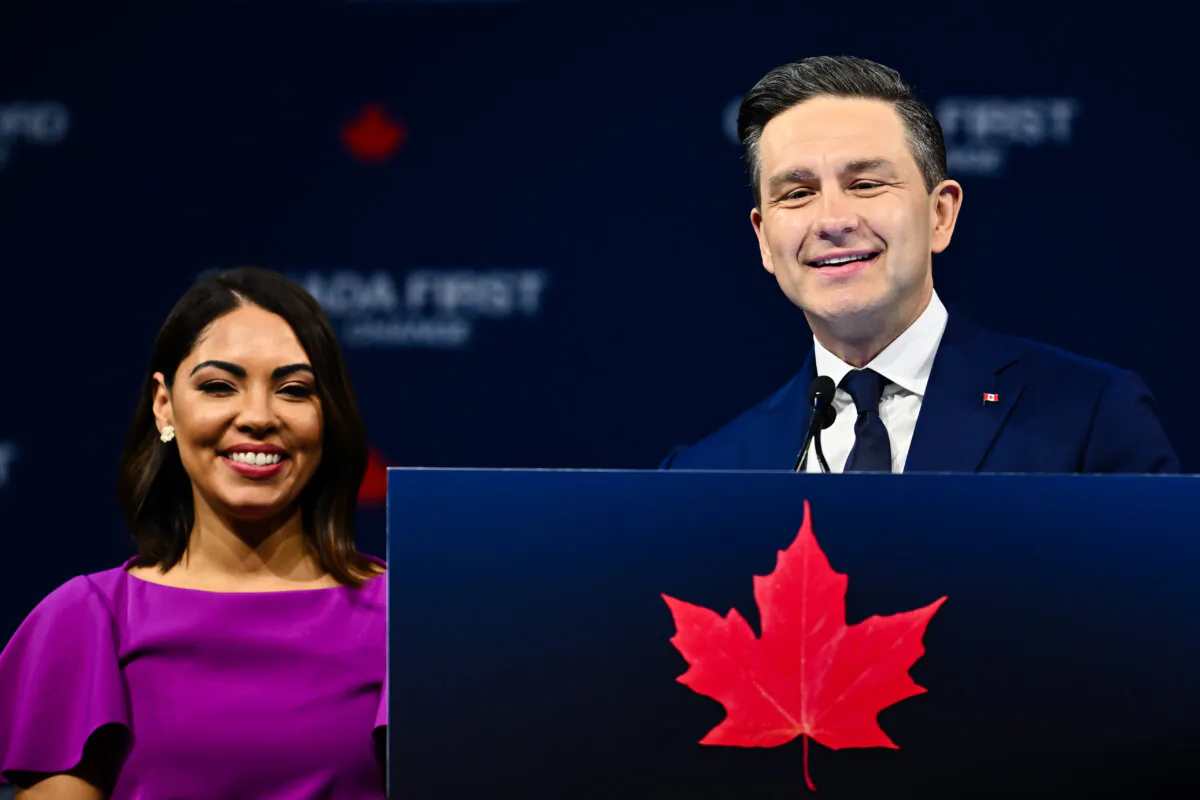 Conservative Party Leader Pierre Poilievre speaks to his supporters alongside his wife, Anaida Poilievre, in Ottawa after losing the federal election on April 29, 2025. (Minas Panagiotakis/Getty Images)