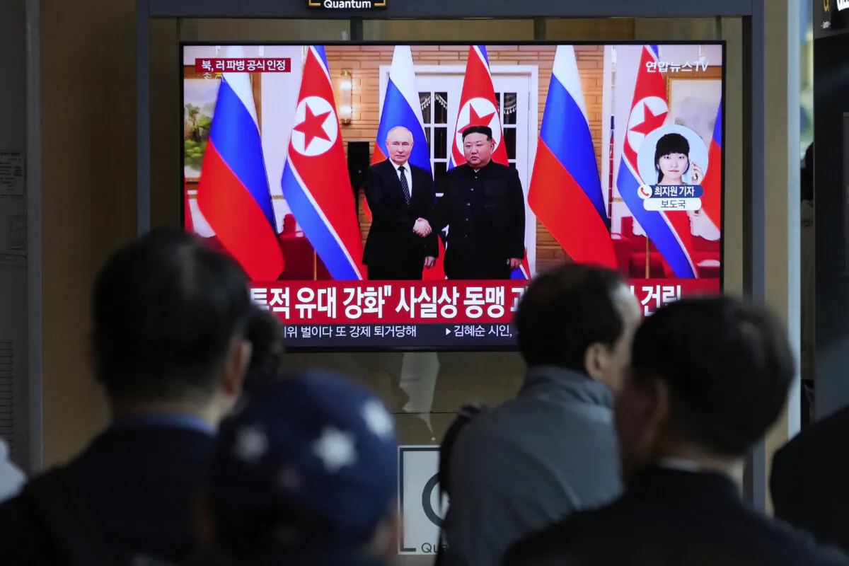 A TV screen shows a file image of North Korean leader Kim Jong Un (R) and  Russian President Vladimir Putin (L) in Pyongyang, North Korea, during a news program at  Seoul railway station in Seoul, South Korea, on April 28, 2025. (Ahn Young-joon/AP)
