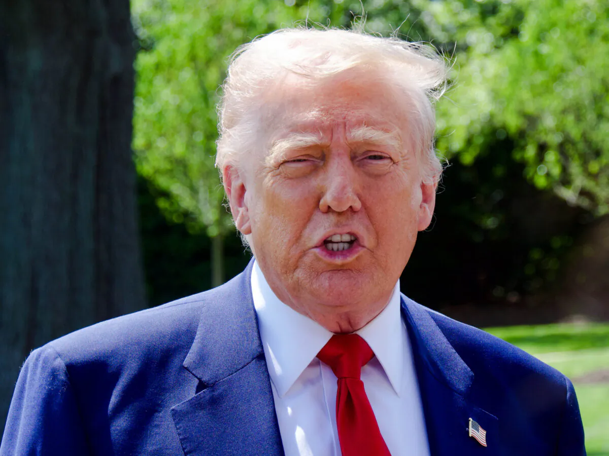 President Donald Trump talks to reporters on the South Lawn of the White House before boarding Marine One on April 29, 2025. (Travis Gillmore/The Epoch Times)